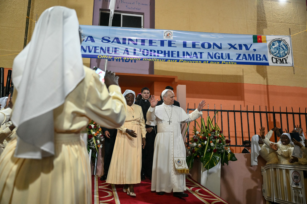 Pope Leo XIV waves to supporters as he leaves after his visit to the Ngul Zamba (Power of God) orphanage in Yaounde, Cameroon, Wednesday April 15, 2026 on the third day of his apostolic journey to Africa. (Alberto Pizzoli, Pool Photo via AP)