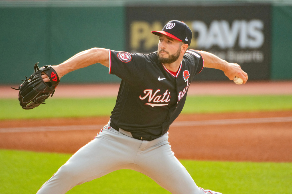 Washington Nationals starting pitcher PJ Poulin delivers against the Cleveland Guardians during the first inning of a baseball game, Monday, May 25, 2026, in Cleveland. (AP Photo/Phil Long)