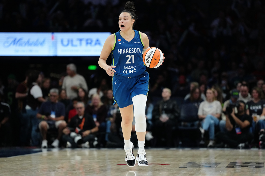 Minnesota Lynx guard Kayla McBride (21) dribbles up the court during the second half of a WNBA basketball game against the Indiana Fever, Thursday, Sept. 24, 2026, in Minneapolis. (AP Photo/Ellen Schmidt)