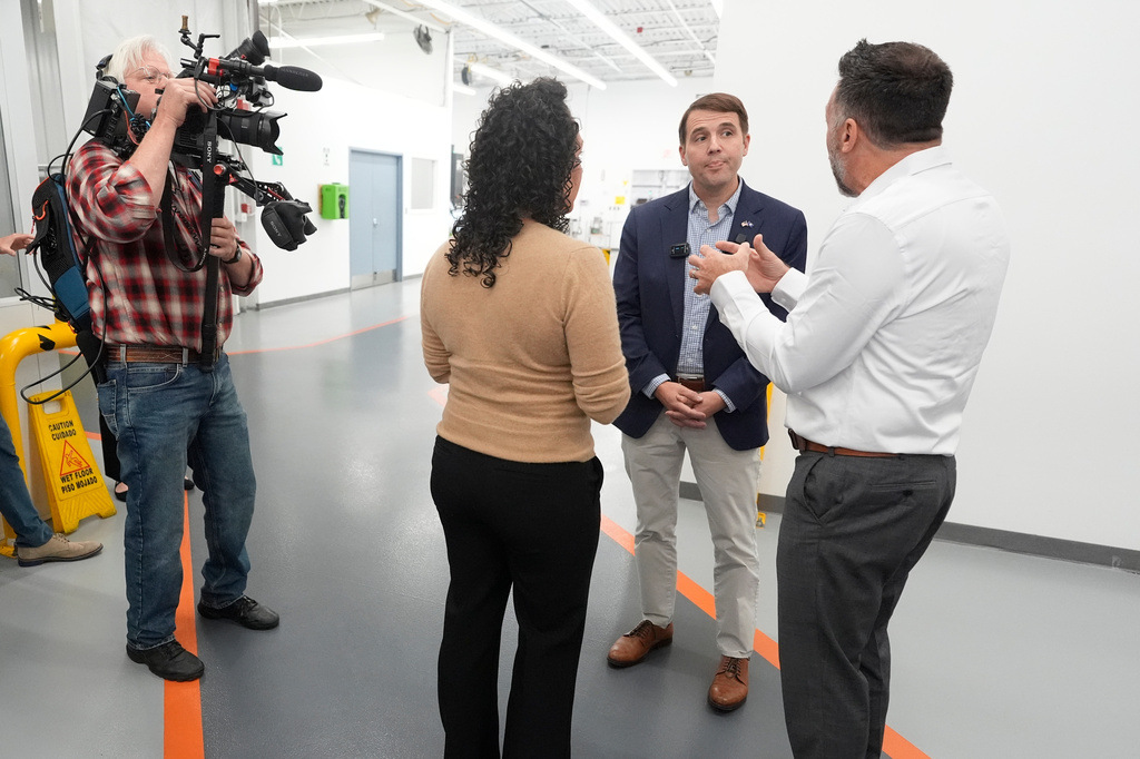 Rep. Chris Pappas, a Democratic candidate for U.S. Senate, listens to Aaron Bagshaw at the WH Bagshaw company, Tuesday, Sept. 29, 2026, in Salem, N.H. (AP Photo/Robert F. Bukaty)