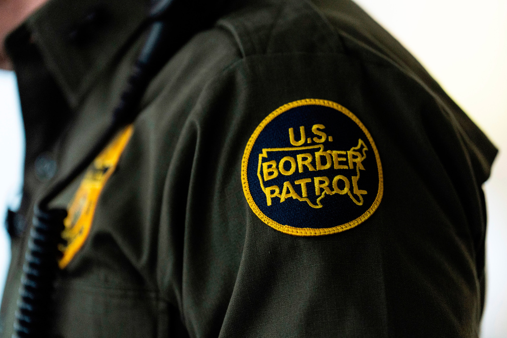 FILE - A U.S Border Patrol badge is displayed as Gregory Bovino, chief patrol agent of the U.S. Border Patrol's El Centro Sector, stands in a conference room before an interview with The Associated Press in Los Angeles, Aug. 25, 2025. (AP Photo/Jae C. Hong, File)