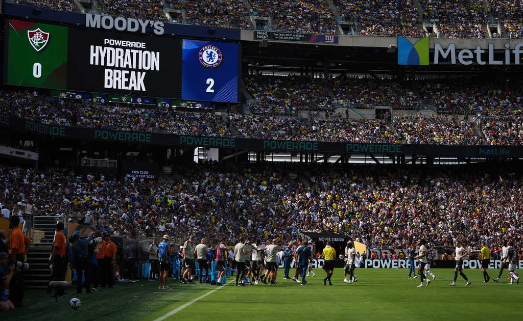 FILE - Fluminense and Chelsea players take a hydration break during the second half of a Club World Cup semifinal soccer match in East Rutherford, N.J., July 8, 2025. (AP Photo/Frank Franklin II, File)