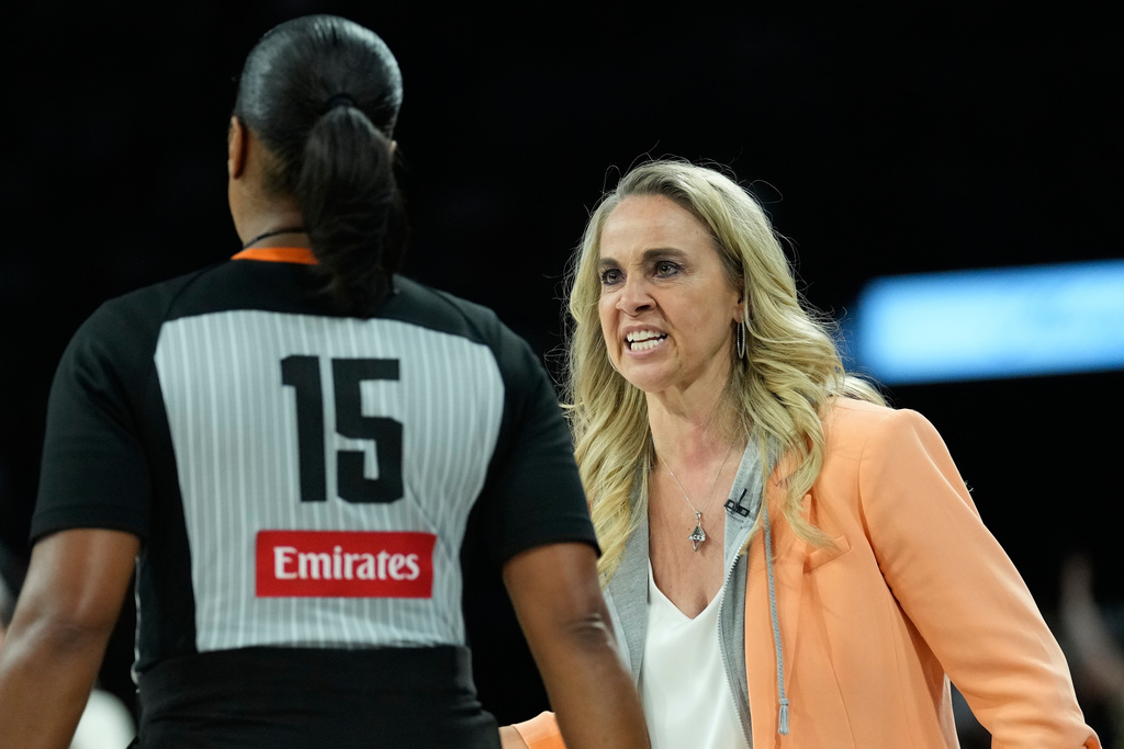 Las Vegas Aces head coach Becky Hammon speaks with an official during the second half of Game 2 of a WNBA basketball playoff semifinals series against the Indiana Fever, Tuesday, Sept. 23, 2025, in Las Vegas. (AP Photo/John Locher)