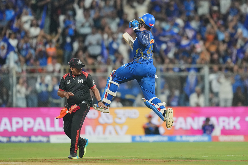 Mumbai Indians' Ryan Rickelton jumps in air as he celebrates after scoring a century during the Indian Premier League cricket match between Mumbai Indians and Sunrisers Hyderabad in Mumbai, India, Wednesday, April 29, 2026.(AP Photo/Rafiq Maqbool)