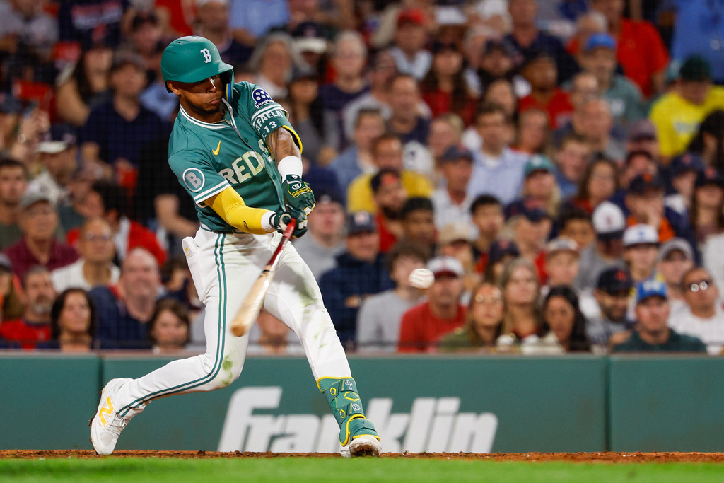 Boston Red Sox outfielder Ceddanne Rafaela (3) hits a double in the seventh inning of a baseball game against the Detroit Tigers, Friday, Sept. 26, 2025, in Boston. (AP Photo/Greg M. Cooper)