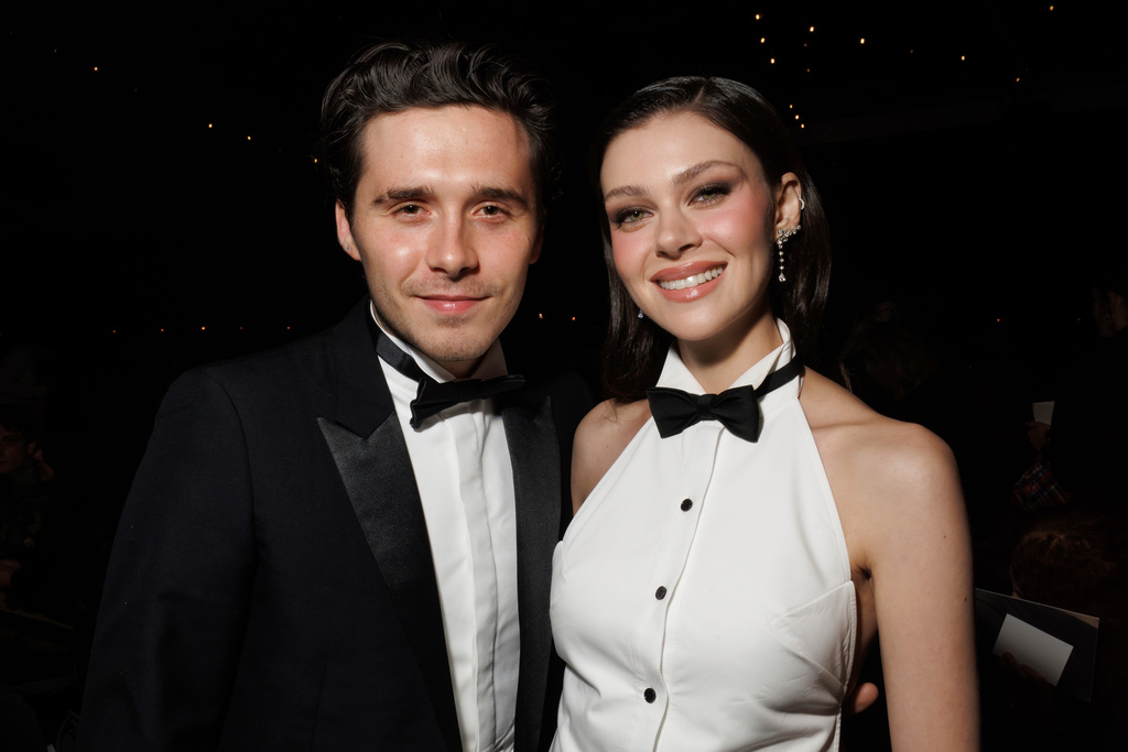 FILE - Brooklyn Beckham, left, and Nicola Peltz attend the Victoria Beckham Spring/Summer 2025 collection presented in Paris on Sept. 27, 2024. (Photo by Vianney Le Caer/Invision/AP, File)
