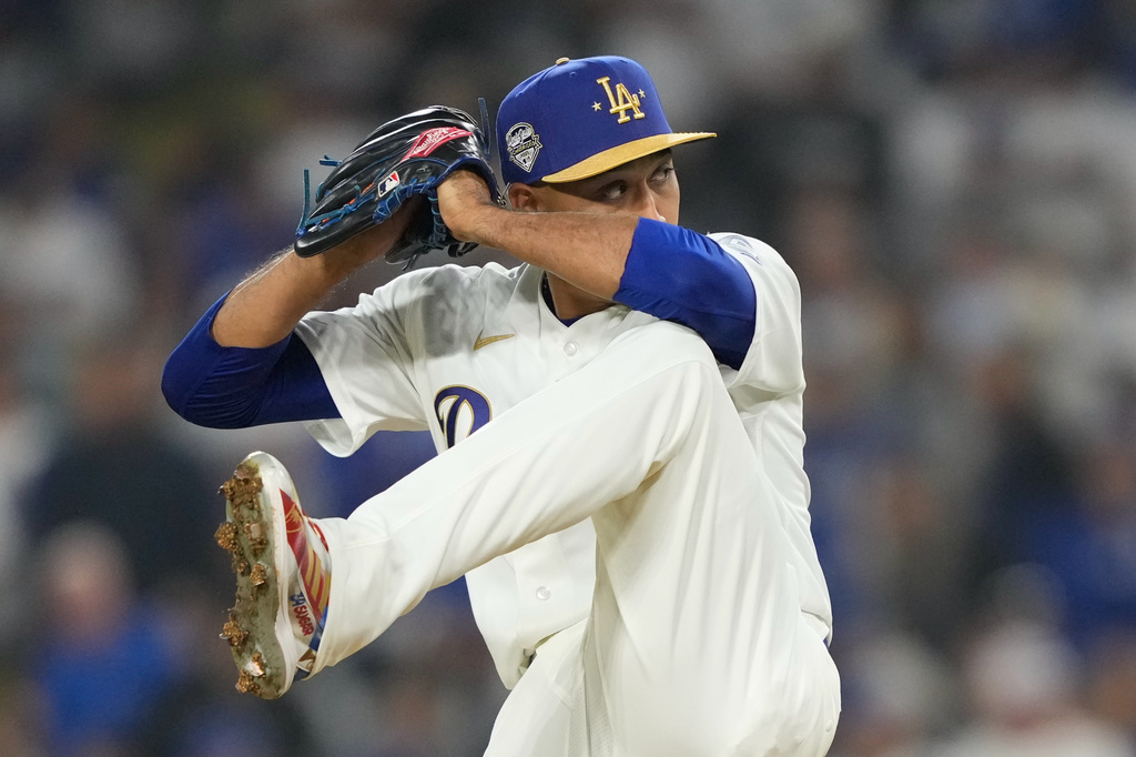 Los Angeles Dodgers relief pitcher Edwin Diaz throws to the plate during the ninth inning of a baseball game against the Arizona Diamondbacks, Friday, March 27, 2026, in Los Angeles. (AP Photo/Mark J. Terrill)