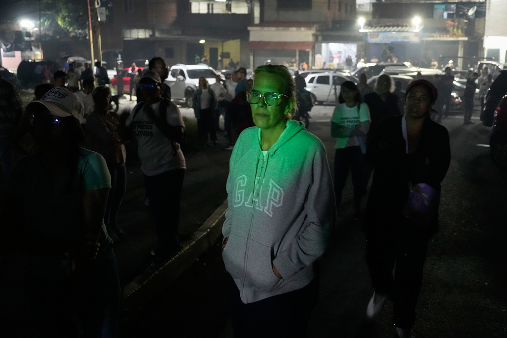 Mariana Gonzalez, the daughter of former presidential candidate Edmundo Gonzalez, stands outside the Rodeo I prison where her husband is detained, in Guatire, Venezuela, Thursday, Jan. 8, 2025, after National Assembly President Jorge Rodriguez said the government would release Venezuelan and foreign prisoners. (AP Photo/Matias Delacroix)