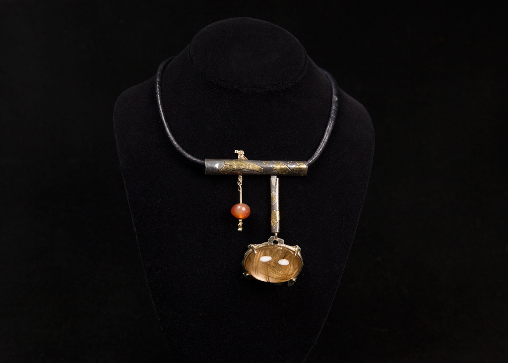 This undated photo provided by the Oakland Museum of California Thursday, Oct. 30, 2025, shows the Rutilated Quartz Dome Neckpiece by Florence Resnikoff at the Oakland Museum of California, in Oakland, Calif. (Leopold Macaya/Oakland Museum of California via AP)