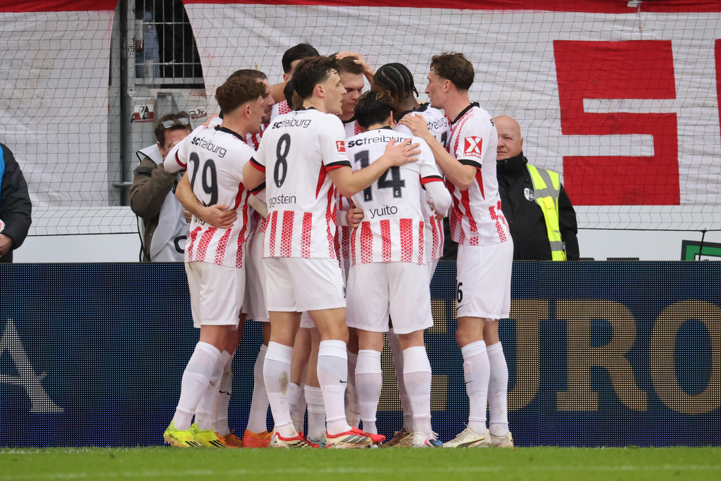 Freiburg players celebrate a goal during the Bundesliga soccer match between SC Freiburg and Borussia Mönchengladbach in Freiburg, Germany, Sunday Feb. 22, 2026. (Philipp von Ditfurth/dpa via AP)