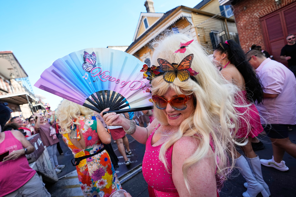 Members of the Krewe of Dolly lead a second line parade in commemoration of the life of Dolly Parton through the French Quarter Friday, Sept. 25, 2026, in New Orleans. (AP Photo/Gerald Herbert)