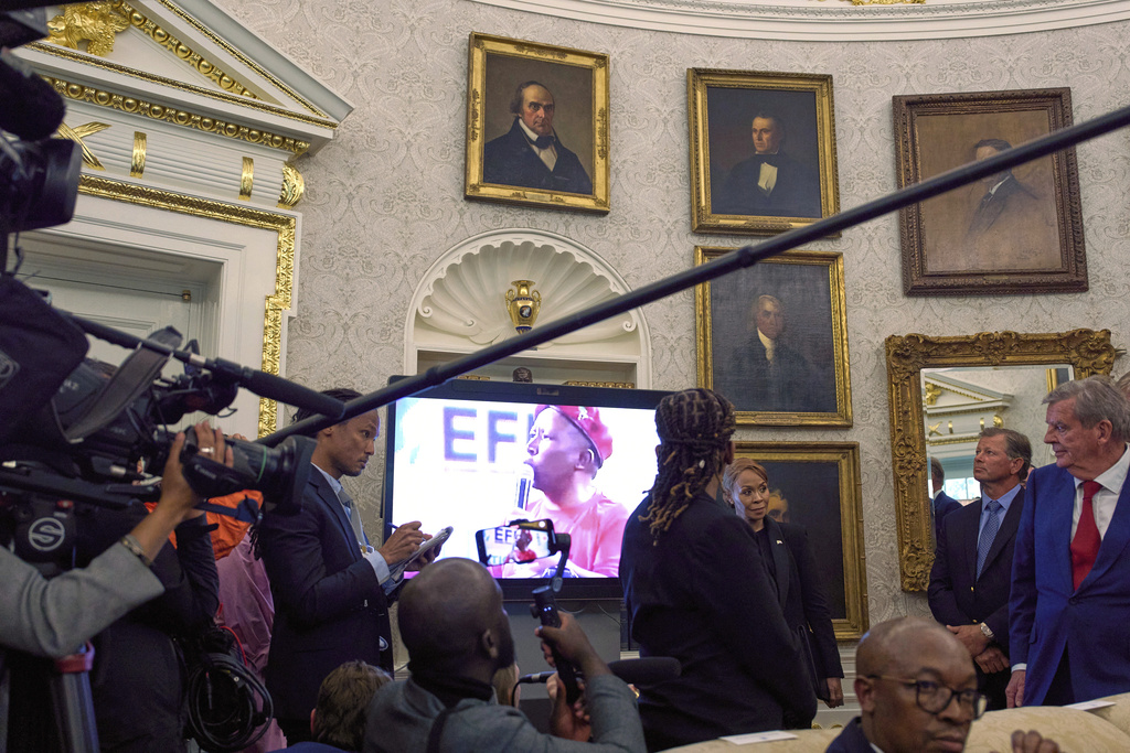 FILE - A video plays during a meeting between President Donald Trump and South Africa's President Cyril Ramaphosa in the Oval Office of the White House, May 21, 2025, in Washington. (AP Photo/Evan Vucci, File)