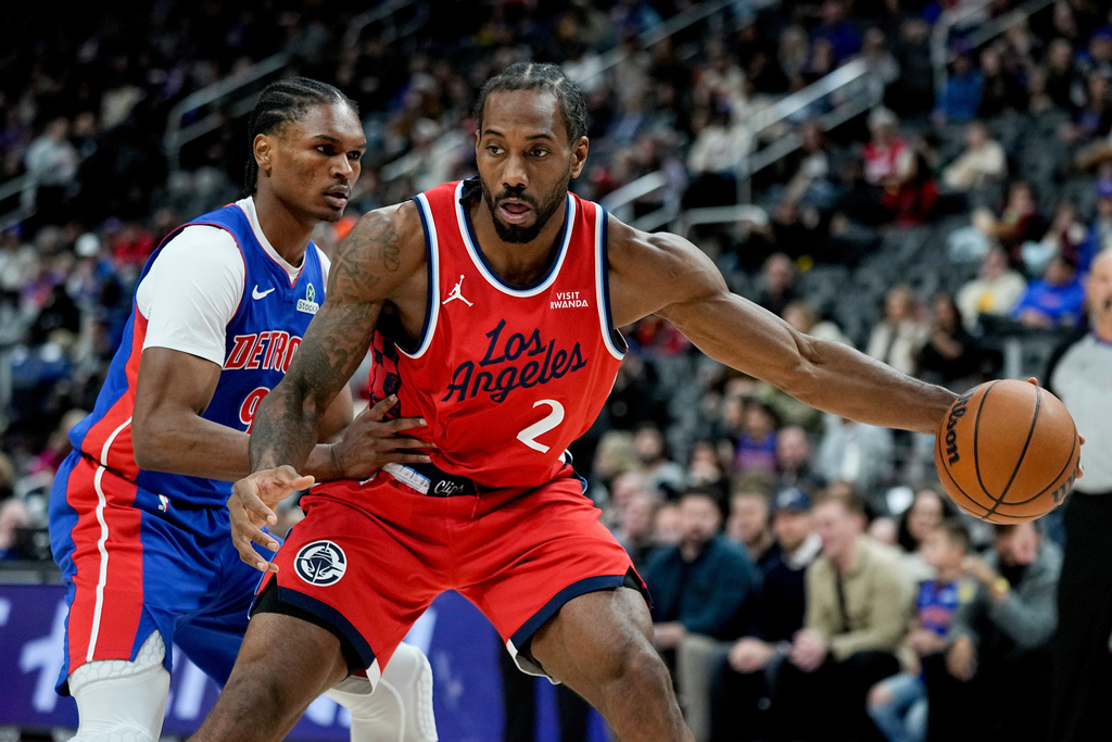 Los Angeles Clippers forward Kawhi Leonard, right, drives against Detroit Pistons guard Ausar Thompson, left, during the first half of an NBA basketball game Saturday, Jan. 10, 2026, in Detroit. (AP Photo/Ryan Sun)