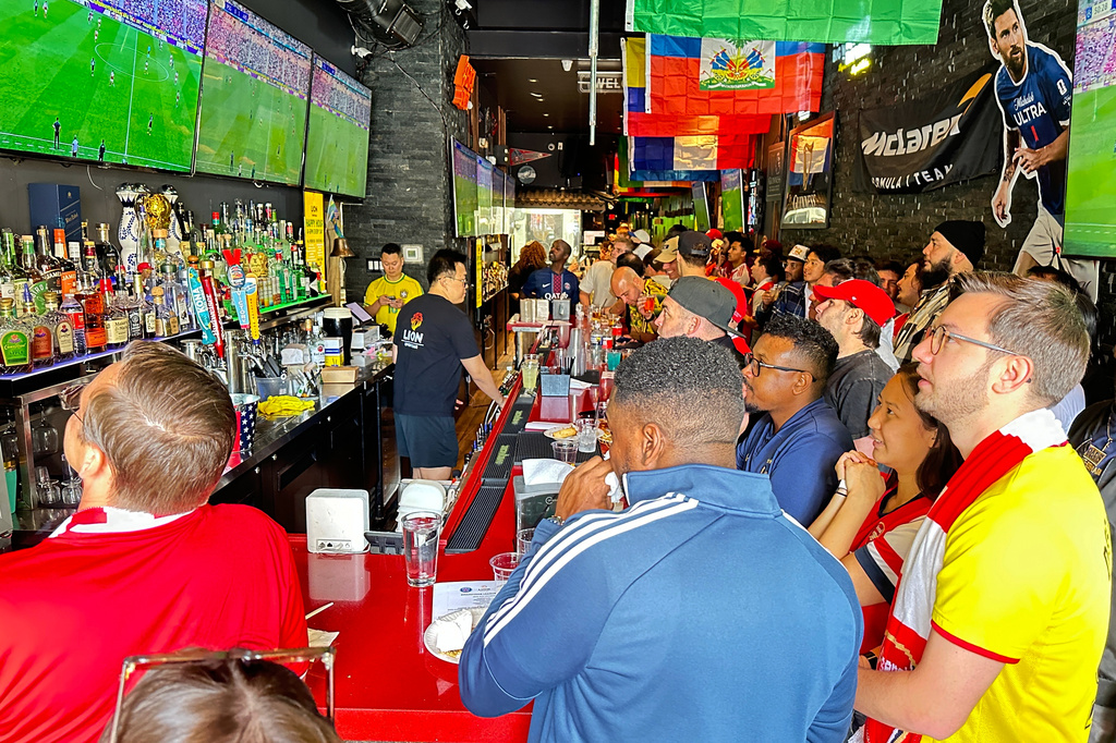 Fans watch a Champion league soccer match between Arsenal and Paris Saint-Germain at the Lion Sports Bar, Saturday, May 30, 2026, in Philadelphia. (AP Photo/Tassanee Vejpongsa)