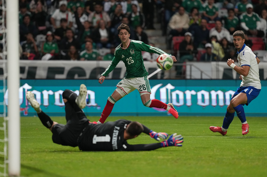 Mexico's Brian Gutierrez (26) attempts a shot on goal against Serbia during an international friendly soccer match in Toluca, Mexico, Thursday, June 4, 2026. (AP Photo/Fernando Llano)