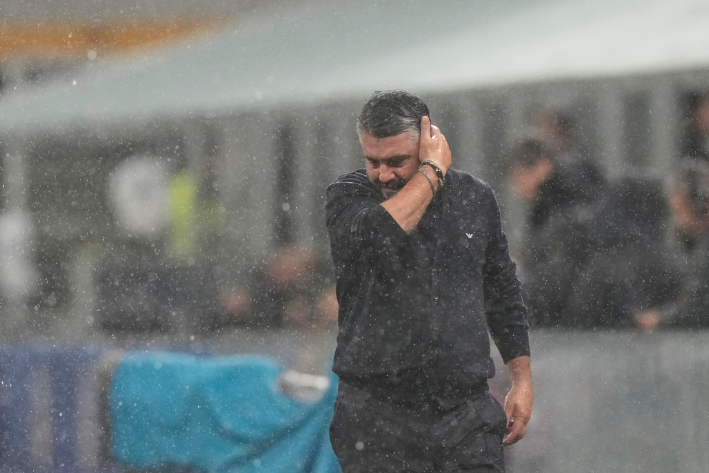 Italy's head coach Gennaro Gattuso walks under the rain before the start of the 2026 World Cup Group I qualifier soccer match between Italy and Norway in Milan, Italy, Sunday, Nov. 16, 2025. (AP Photo/Luca Bruno)