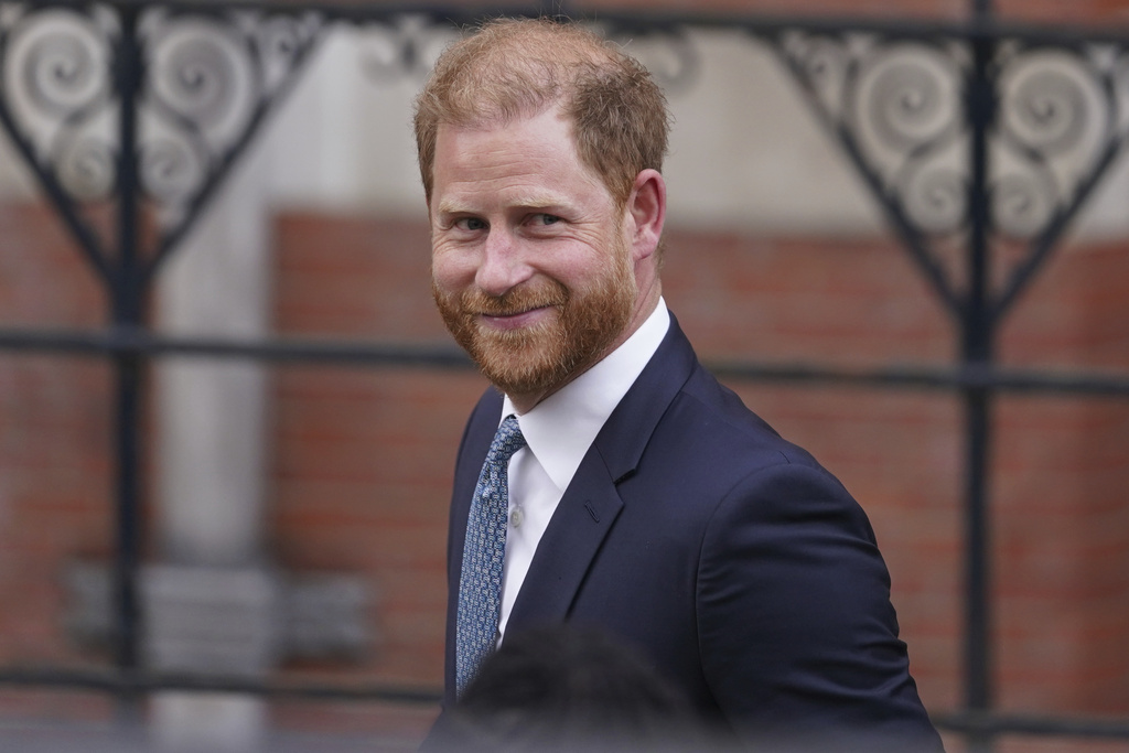 FILE - Britain's Prince Harry smiles towards the media as he leaves the Royal Courts of Justice in London, Tuesday, April 8, 2025. (AP Photo/Alberto Pezzali, File)