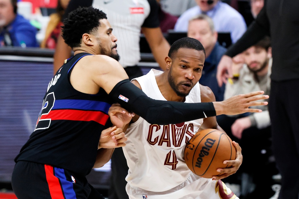 Cleveland Cavaliers center Evan Mobley (4) drives against Detroit Pistons forward Tobias Harris, left, during the second half of an NBA basketball game Friday, Feb. 27, 2026, in Detroit. (AP Photo/Duane Burleson)