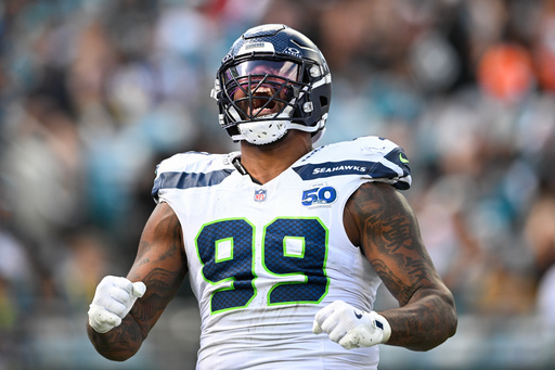 Seattle Seahawks defensive end Leonard Williams (99) reacts after sacking Jacksonville Jaguars quarterback Trevor Lawrence during the first half of an NFL football game Sunday, Oct. 12 2025, in Jacksonville, Fla. (AP Photo/Phelan M. Ebenhack) Seattle Seahawks defensive end Leonard Williams (99) reacts after sacking Jacksonville Jaguars quarterback Trevor Lawrence during the first half of an NFL football game Sunday, Oct. 12 2025, in Jacksonville, Fla. (AP Photo/Phelan M. Ebenhack)