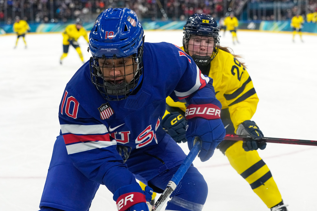 United States' Laila Edwards (10) challenges with Sweden's Felizia Wikner Zienkiewicz (29) during a women's ice hockey semifinal game between the United States and Sweden at the 2026 Winter Olympics, in Milan, Italy, Monday, Feb. 16, 2026. (AP Photo/Hassan Ammar)
