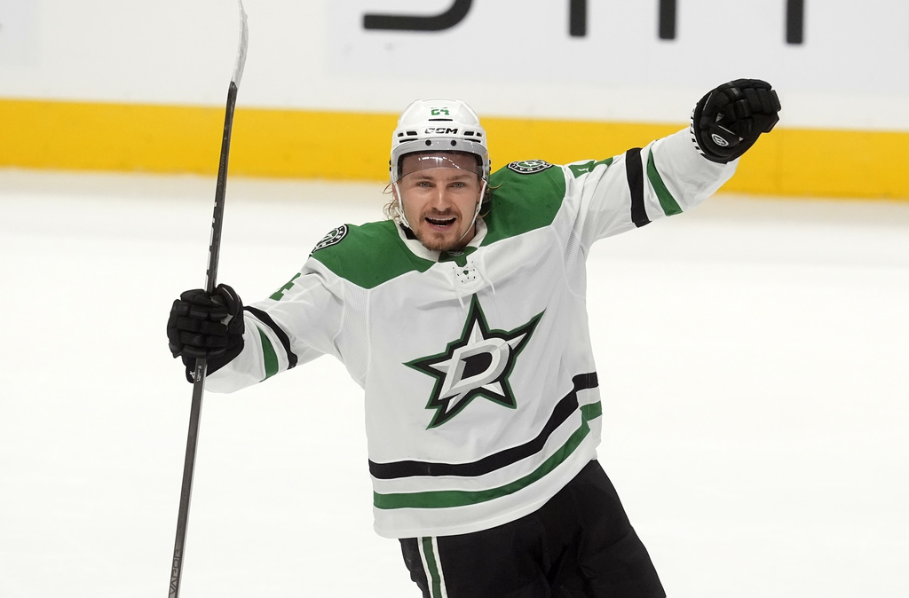 Dallas Stars centre Roope Hintz (24) celebrates his game-winning goal in overtime during an NHL hockey game, in Ottawa, Ontario, Tuesday, Nov. 11, 2025. (Adrian Wyld/The Canadian Press via AP)
