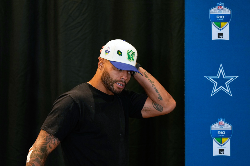 Dallas Cowboys quarterback Dak Prescott arrives for a press conference after an NFL football game against the Baltimore Ravens in Rio de Janeiro, Sunday, Sept. 27, 2026. (AP Photo/Fernando Llano)