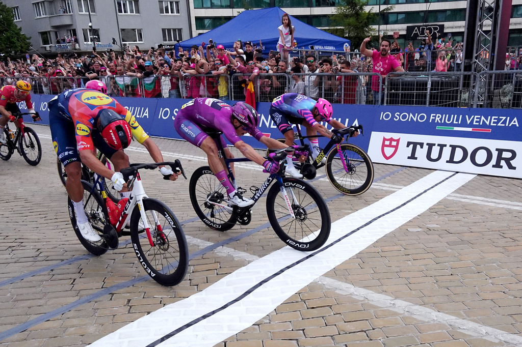 France's Paul Magnier, center, wins the third stage of the Giro d'Italia cycling race, from Plovdiv to Sofia, Bulgaria, Sunday, May 10, 2026. (Massimo Paolone /LaPresse via AP)