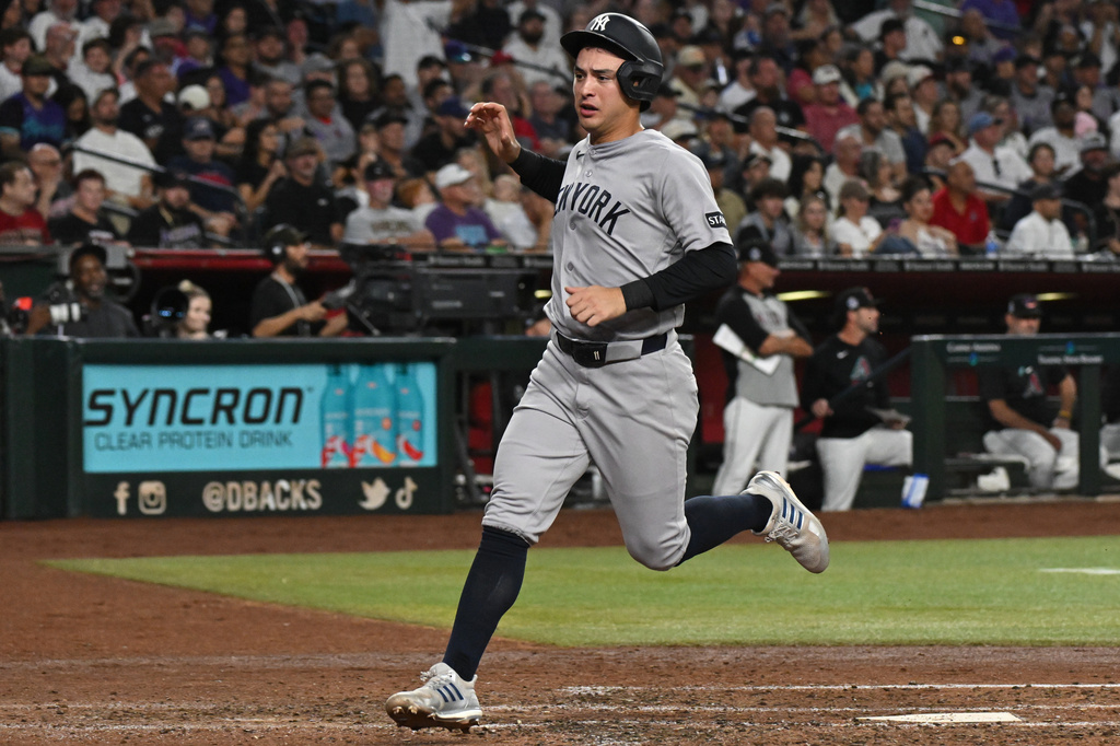 New York Yankees Anthony Volpe scores during the fifth inning of a baseball game against the Arizona Diamondbacks, Saturday, Sept. 19, 2026, in Phoenix. (AP Photo/Caitlin O'Hara)