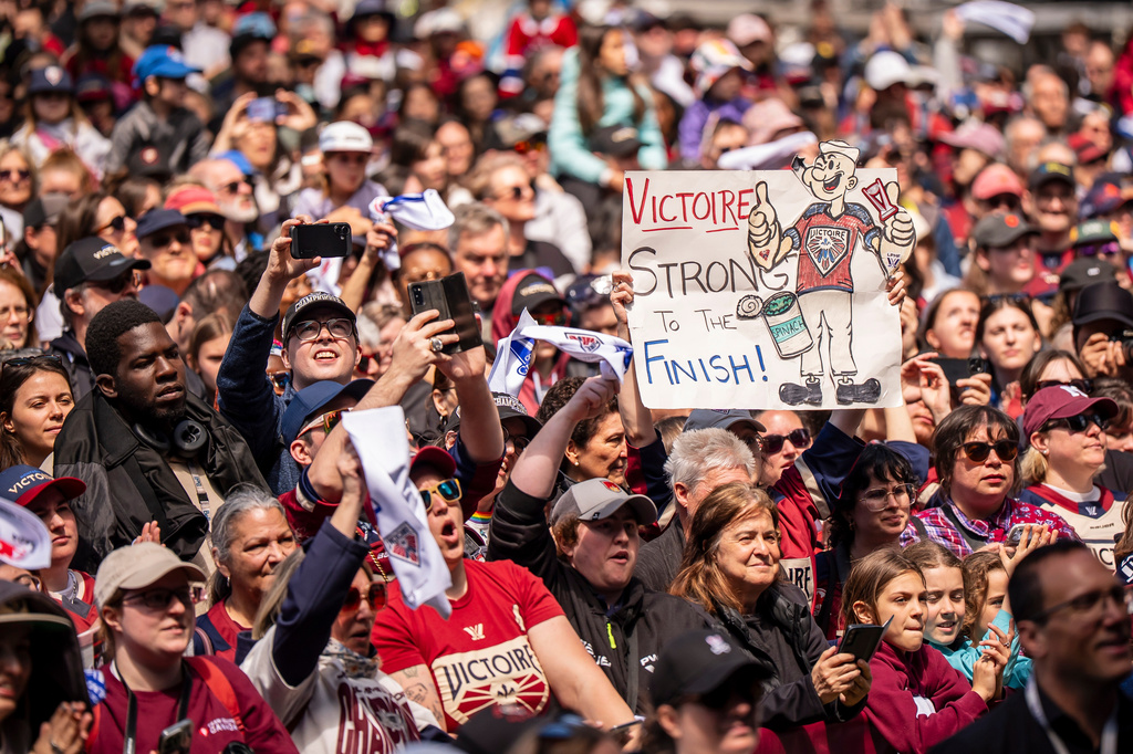 Fans cheer the Montreal Victoire during the PWHL hockey team's championship celebration in Montreal, Saturday, May 30, 2026. (Christopher Katsarov/The Canadian Press via AP)