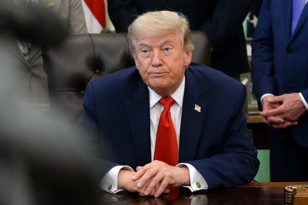 President Donald Trump listens during an event to sign a proclamation about the fishing industry, in the Oval Office of the White House, Thursday, June 11, 2026, in Washington. (AP Photo/Jacquelyn Martin)