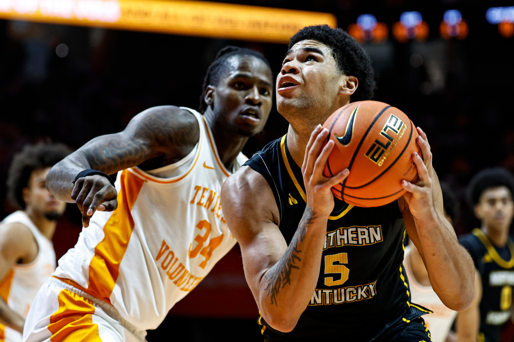 FILE - Northern Kentucky forward LJ Wells (5) goes for a shot as he's defended by Tennessee center Felix Okpara (34) during the second half of an NCAA college basketball game Nov. 8, 2025, in Knoxville, Tenn. (AP Photo/Wade Payne, File)