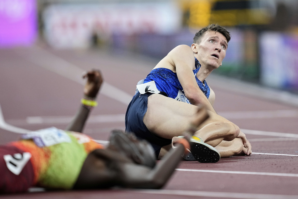Britain's Jake Wightman sits on the track after taking silver in the men's 1,500 meters final at the World Athletics Championships in Tokyo, Wednesday, Sept. 17, 2025. (AP Photo/Hiro Komae)