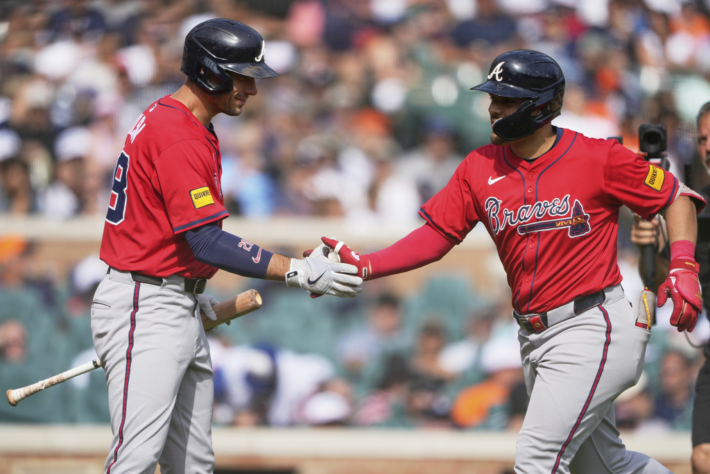 Atlanta Braves' Nacho Alvarez Jr., right, celebrates his solo home run with Matt Olson during the eighth inning of a baseball game against the Detroit Tigers, Saturday, Sept. 20, 2025, in Detroit. (AP Photo/Ryan Sun)