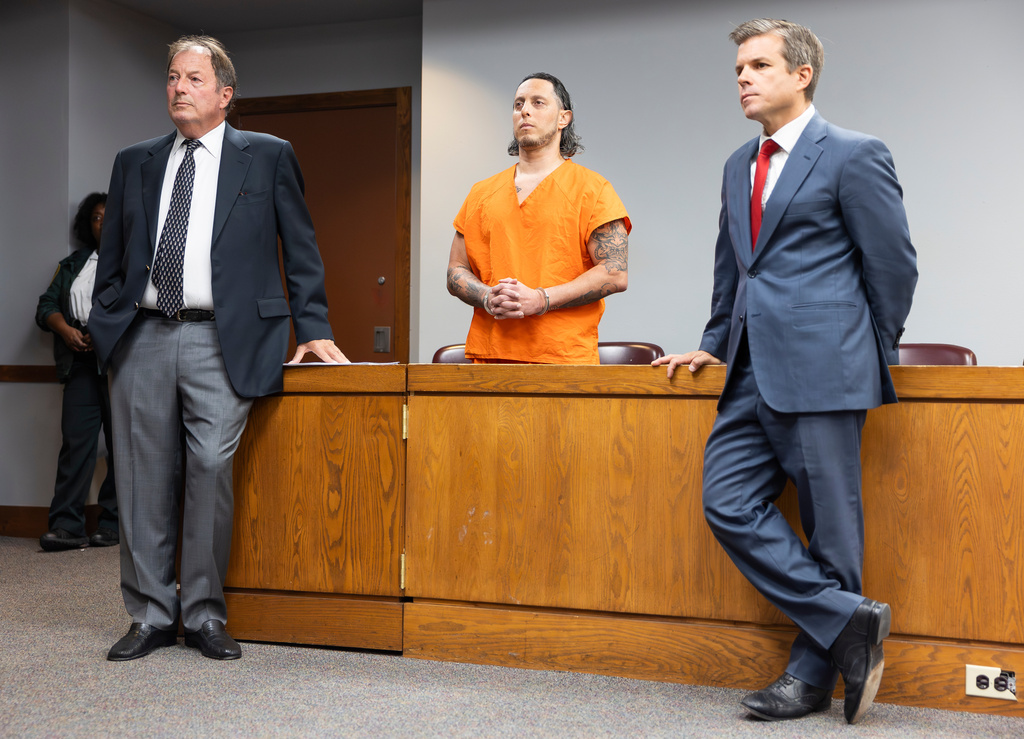 Oscar Olea, center, a former Key Biscayne gymnastics coach who allegedly sexually abused his students, listens to Miami-Dade Circuit Judge Alberto Milian at the Richard E. Gerstein Justice Building on Thursday, Aug. 14, 2025, in Miami. (Matias J. Ocner/Miami Herald via AP, Pool)