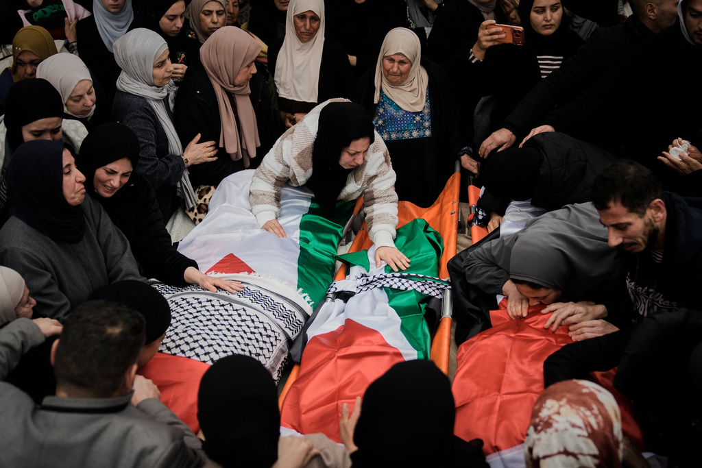 Palestinians mourn at the funeral of four members of the Odeh family who were killed in their car by Israeli security forces during an army operation in Tammun, West Bank, Sunday, March 15, 2026. (AP Photo/Majdi Mohammed)