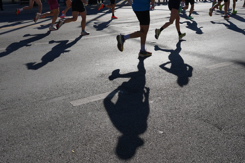 Runners participate in the Chicago Marathon, Sunday, Oct. 12, 2025. (AP Photo/Nam Y. Huh)