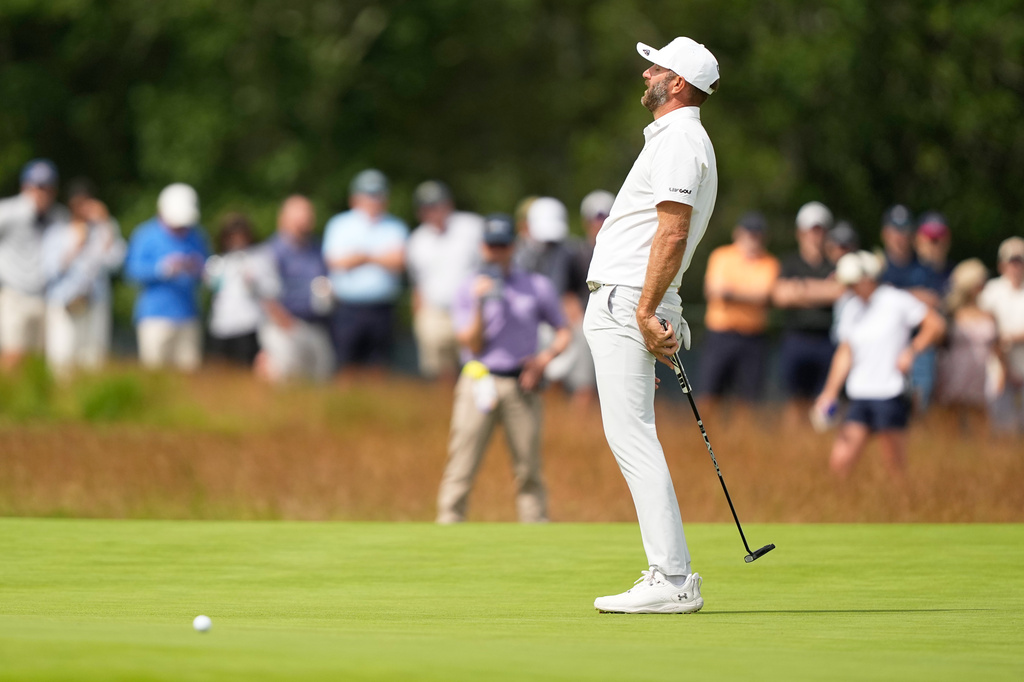 Dustin Johnson reacts after missing a putt during the second round of the U.S. Open golf tournament at Shinnecock Hills Golf Club in Southampton, N.Y., Friday, June 19, 2026.(AP Photo/Gerald Herbert)