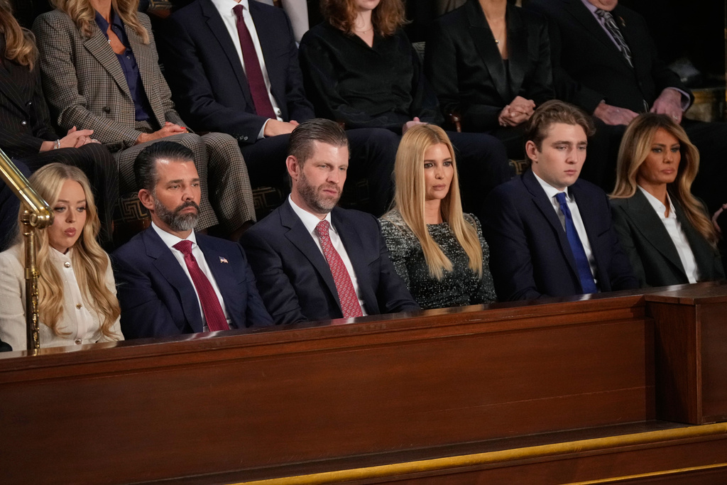 Tiffany Trump, from left, Donald Trump Jr., Eric Trump, Ivanka Trump, Barron Trump and first lady Melania Trump listen as President Donald Trump delivers the State of the Union address to a joint session of Congress in the House chamber at the U.S. Capitol in Washington, Tuesday, Feb. 24, 2026. (AP Photo/Mark Schiefelbein)