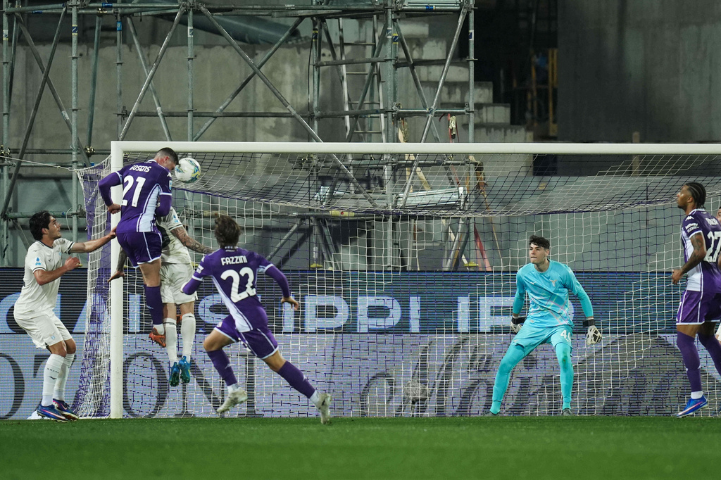 Fiorentina's Robin Everardus Gosens heads the ball to score their side's first goal of the game during the Serie A soccer match between Fiorentina and Lazio in Florence, Italy, Monday, April 13, 2026. (Massimo Paolone/LaPresse via AP)