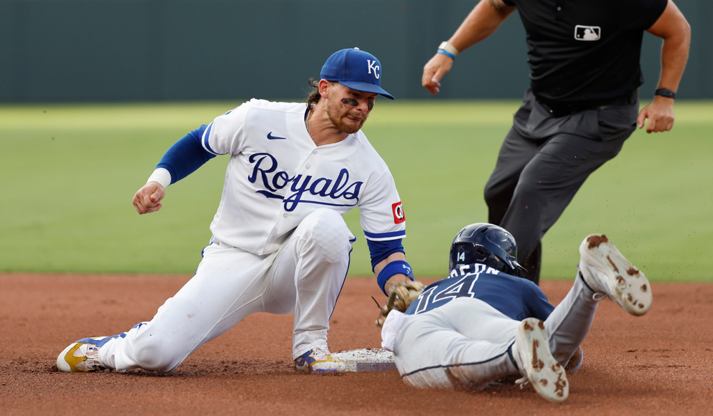 Kansas City Royals shortstop Bobby Witt Jr., left, tags out Tampa Bay Rays' Chandler Simpson, right, after attempting to steal second base during the fourth inning of a baseball game in Kansas City, Mo., Wednesday, July 1, 2026. (AP Photo/Colin E. Braley)