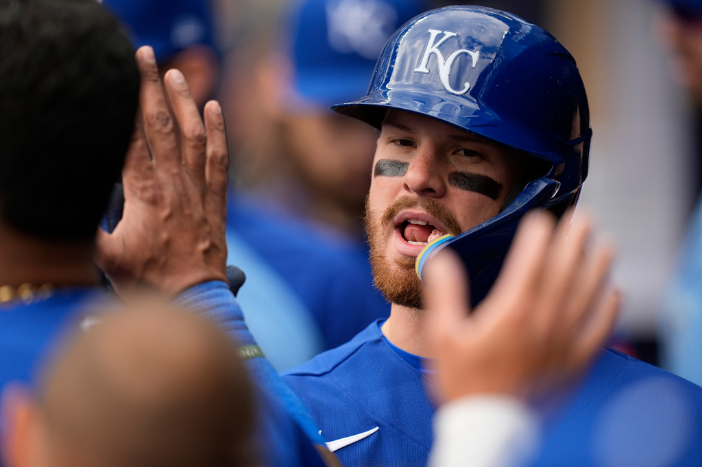 Kansas City Royals' Bobby Witt Jr. (7) celebrates scoring on a sacrafice fly by Kansas City Royals' Carter Jensen in the seventh inning of a baseball game against the Atlanta Braves, Sunday, March 29, 2026, in Atlanta. (AP Photo/Mike Stewart)