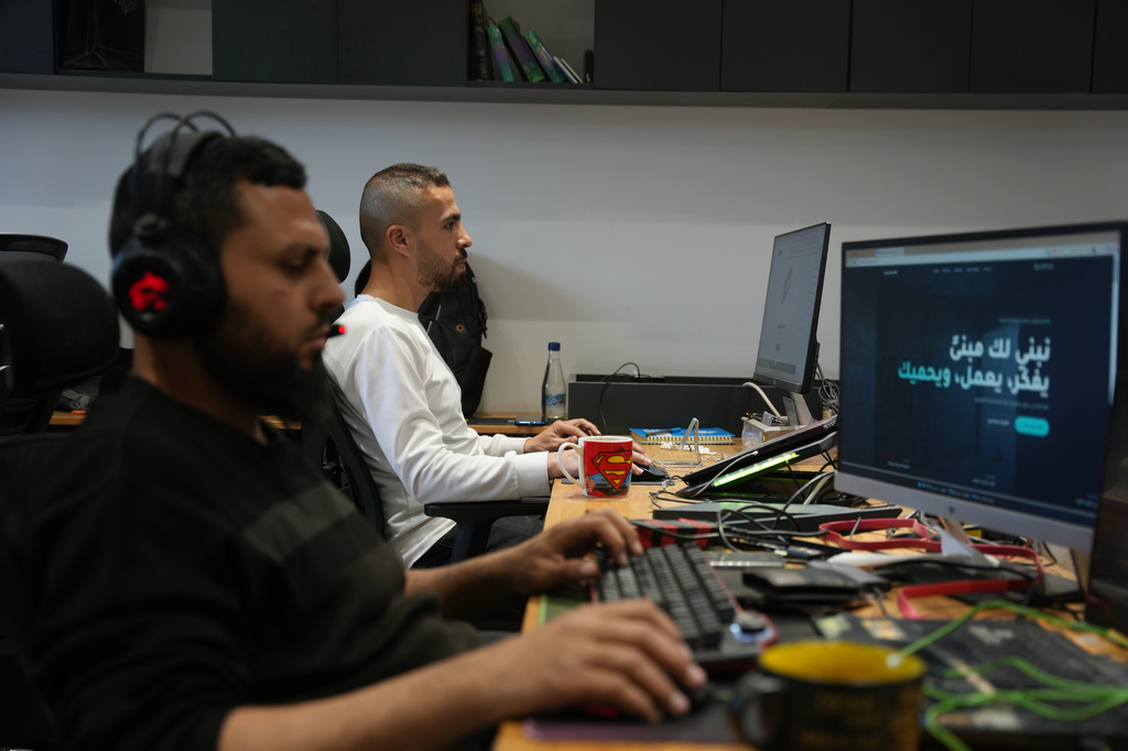 Palestinian digital freelancers work on projects for clients abroad at a coworking space in Gaza City, Tuesday, May 12, 2026. (AP Photo/Abdel Kareem Hana)
