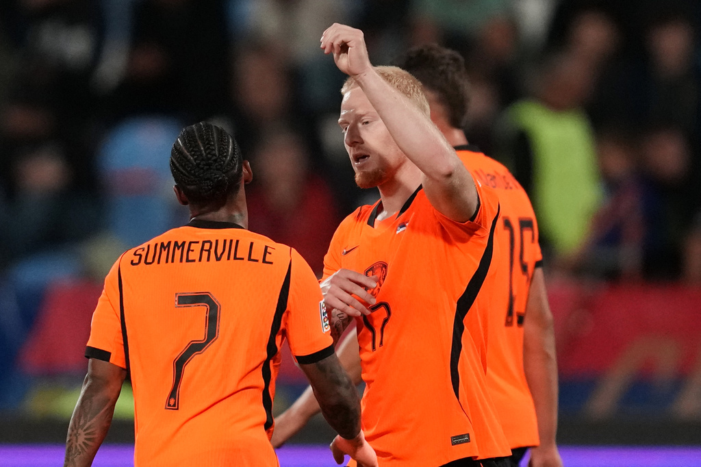 Netherlands' Mexx Meerdink celebrates with' Crysencio Summerville, left, after scoring his side's second goal during the Nations League soccer match between Serbia and the Netherlands in Belgrade, Serbia, Sunday, Sept. 27, 2026. (AP Photo/Darko Vojinovic)