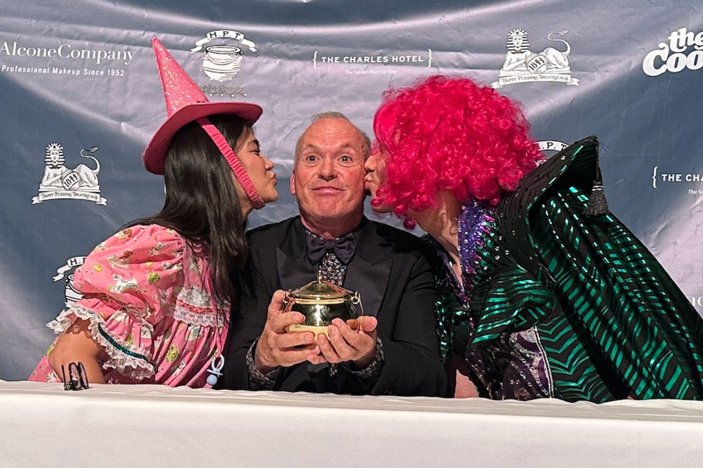Actor Michael Keaton holds up his Pudding Pot that he received after being named 2026 Man of the Year from Harvard University's Hasty Pudding Theatricals at Harvard University in Cambridge, Mass., Friday, Feb. 6, 2026. (AP Photo/Michael Casey)