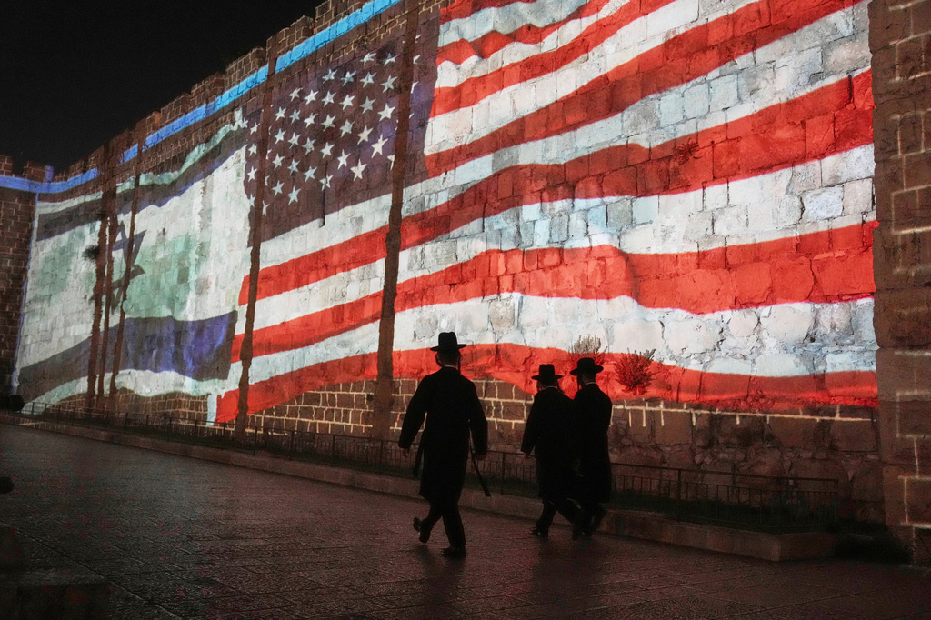 FILE - An Image of the U.S. and Israeli flags is projected on the walls of Jerusalem's Old City, Sunday, July 22, 2025. Following the U.S. involvement in the war between Israel and Iran. (AP Photo/Mahmoud Illean, File)