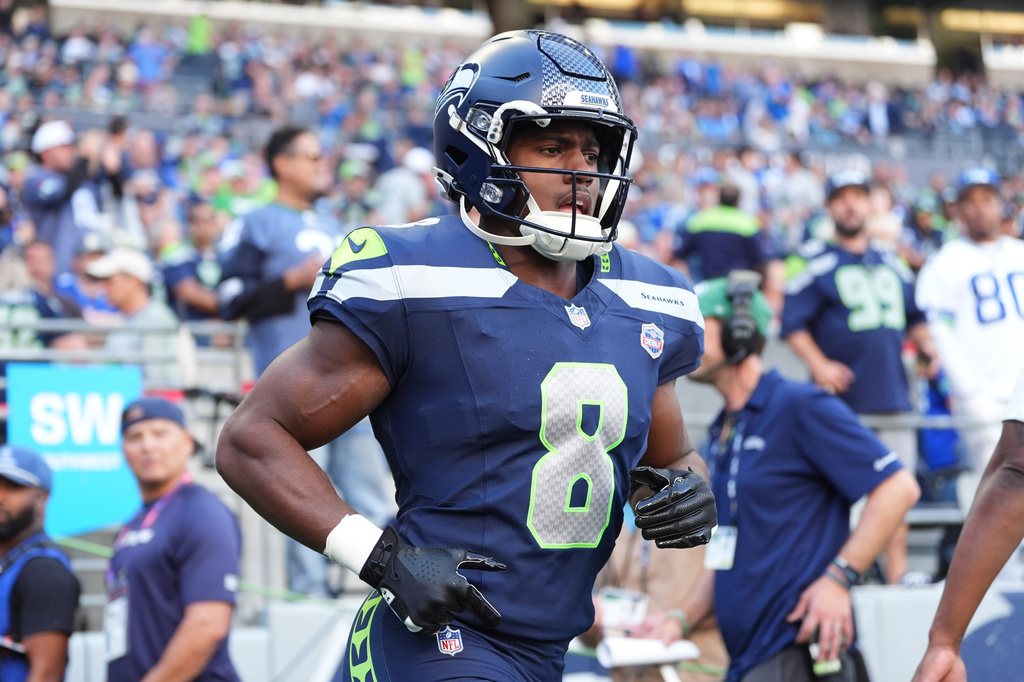 Seattle Seahawks running back Jadarian Price runs during warmups before an NFL football game against the New England Patriots, Wednesday, Sept. 9, 2026, in Seattle. (AP Photo/Lindsey Wasson)