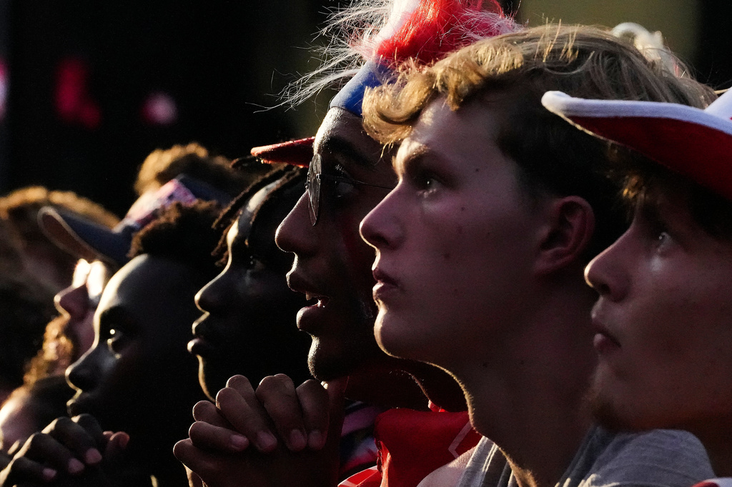 Fans watch a World Cup round of 16 soccer match between the United States and Belgium at the KC Live! entertainment district Monday, July 6, 2026, in Kansas City, Mo. (AP Photo/Charlie Riedel)