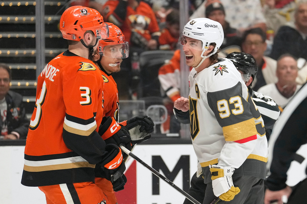 Vegas Golden Knights right wing Mitch Marner, right, laughs at Anaheim Ducks defenseman Ian Moore, left, and center Mikael Granlund during the second period in Game 6 of a second-round NHL hockey Stanley Cup playoff series Thursday, May 14, 2026, in Anaheim, Calif. (AP Photo/Mark J. Terrill)