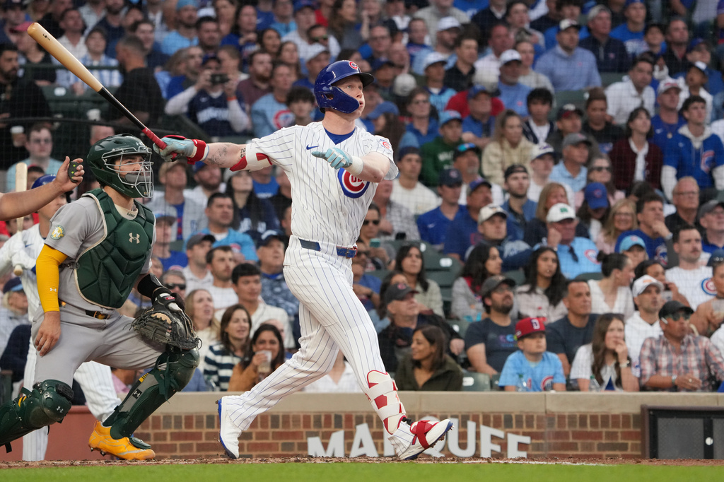 Chicago Cubs' Pete Crow-Armstrong hits a two-run against the Athletics during the third inning in a baseball game Wednesday, June 3, 2026, in Chicago. (AP Photo/David Banks)