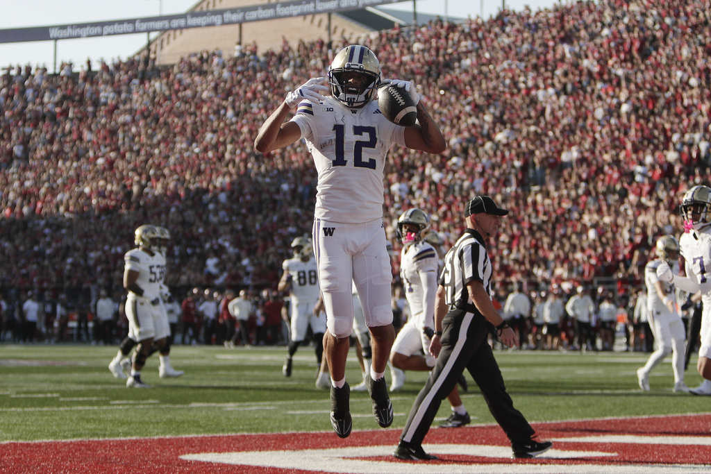 Washington wide receiver Denzel Boston (12) celebrates after his touchdown during the first half of an NCAA college football game against Washington State, Saturday, Sept. 20, 2025, in Pullman, Wash. (AP Photo/Young Kwak)